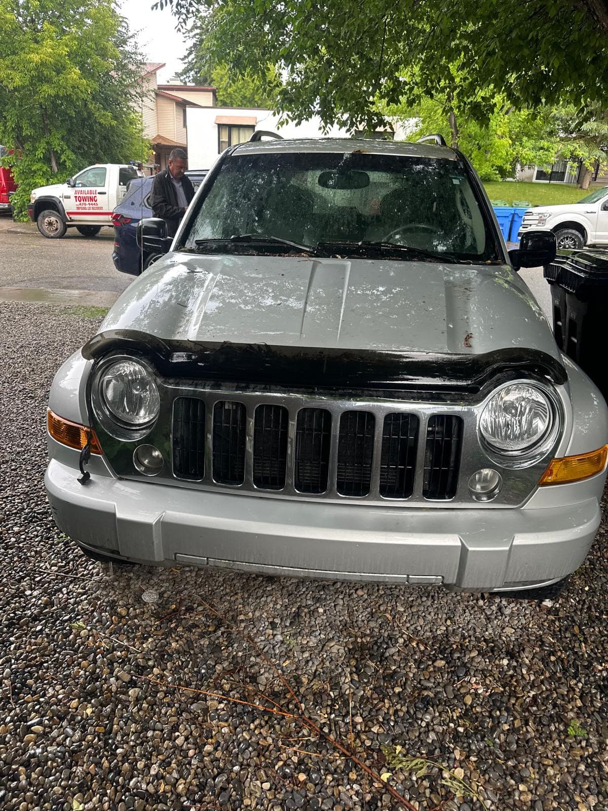 Older vehicle awaiting driveway pickup in Calgary